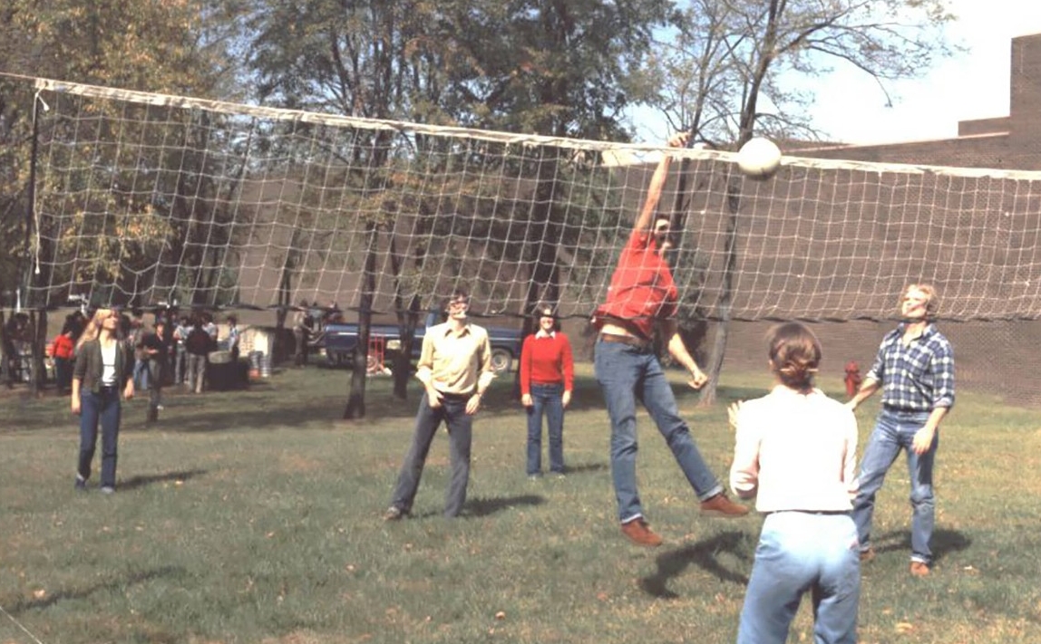 UC Clermont students play volleyball and enjoy a picnic on campus, 1981.