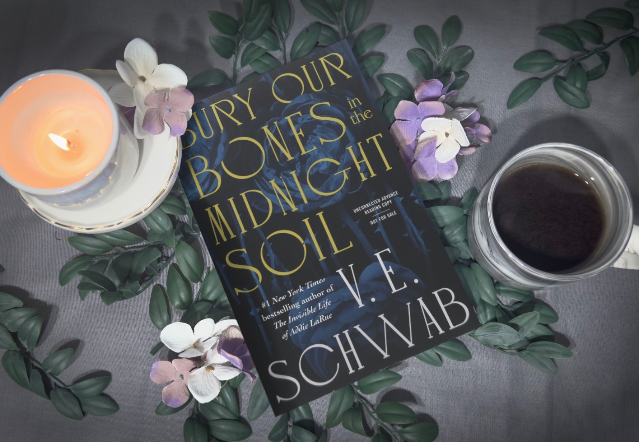 Image of a book, cup of coffee and a candle