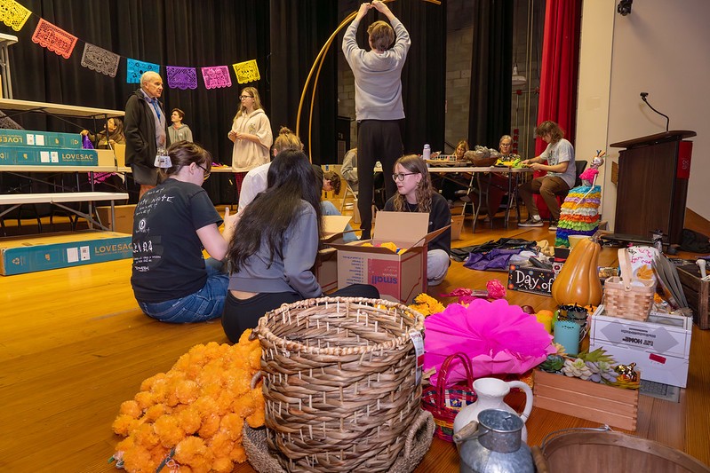 students and faculty set up the altar