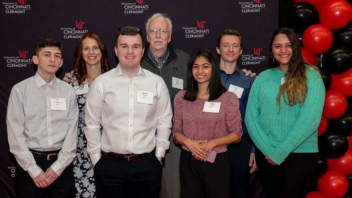 Donor Dennis Cronin (background) with the first group of Cronin Career Scholars in spring 2024. From left: Will Landaverde, Nathan Gorman, Yatra Patel, Luke Ustick and Sara Nayrouz.
